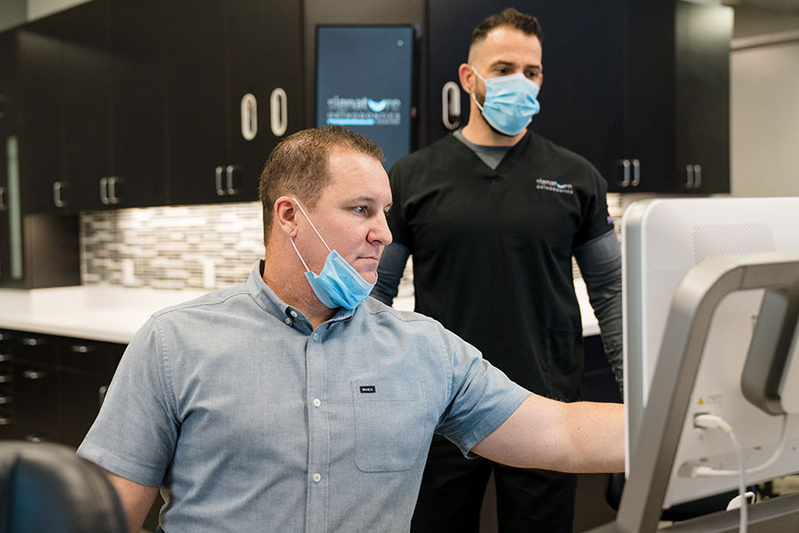 Dr. John R. Jerome reviewing 3D scans for a surgical orthodontics treatment plan in San Diego