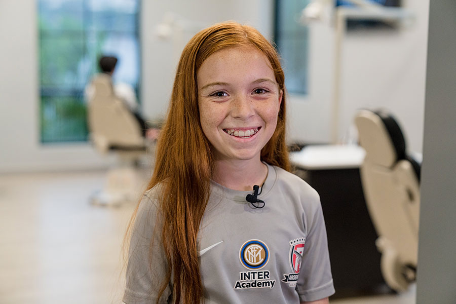 Happy clear aligners patient with a straight, confident smile — Signature Orthodontics, San Diego