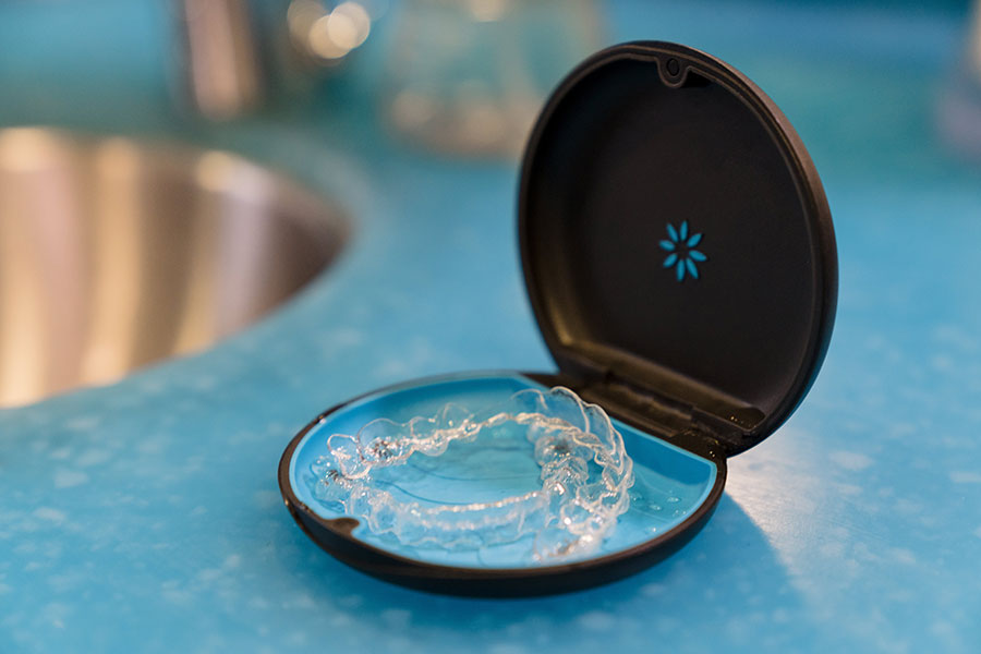 Close-up of a clear Invisalign aligner tray used at Signature Orthodontics in San Diego